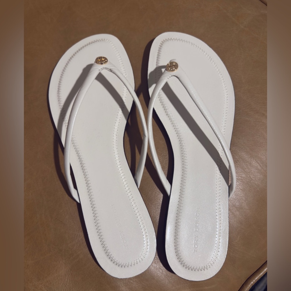 Brand New Tory Burch White Flip-Flops Size 9. Never worn, in original box.